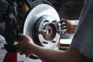 Closeup of car mechanic repairing brake pads | Sherwood Forest Auto Specialists