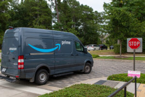 Efficient Fleet Maintenance Services | Sherwood Forest Auto Specialists. Image of Amazon prime delivery truck stopped at a stop sign.